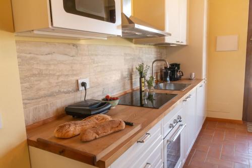 Kuchyň nebo kuchyňský kout v ubytování Appartamento in Villa con Jacuzzi