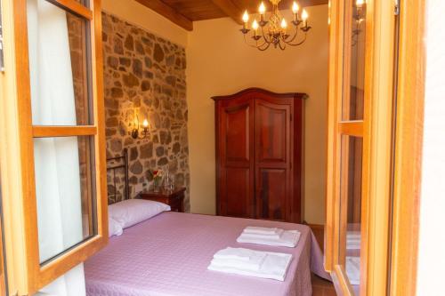 Postel nebo postele na pokoji v ubytování Appartamento in Villa con Jacuzzi