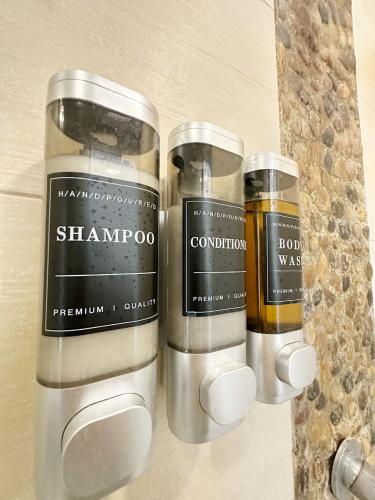 a couple of bottles of liquids sitting on a counter at Beach Apartment At Nikki Residences 2 Bedroom in El Chirú