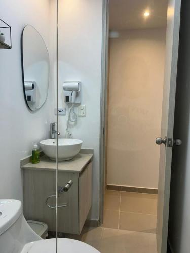 a bathroom with a sink and a mirror at Vicmag House Barranquilla in Barranquilla
