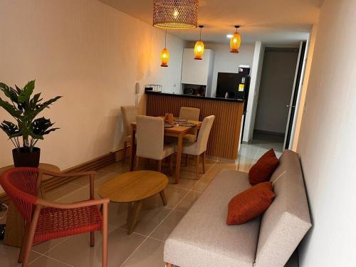 a living room with a couch and a table at Vicmag house barranquilla in Barranquilla