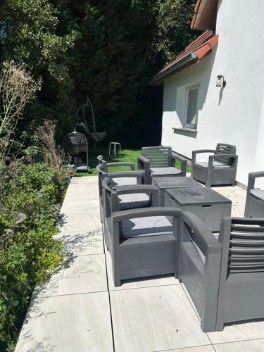 a row of benches sitting next to a building at L'échapée belle in Beinheim