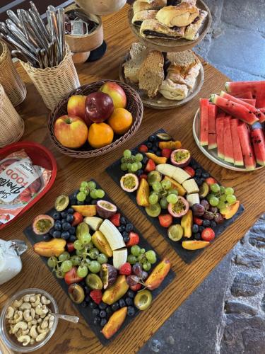 a table with many different types of fruits and vegetables at Hotel Kocour in Třebíč