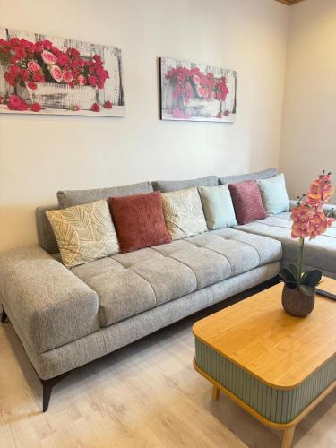 a living room with a couch and a coffee table at Mahesars Home 2 in Ennepetal