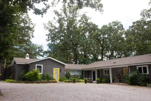 a house with a driveway in front of it at Crystal Serenity Quartz Soak The Namaste Studio On Lake Hamilton in Hot Springs