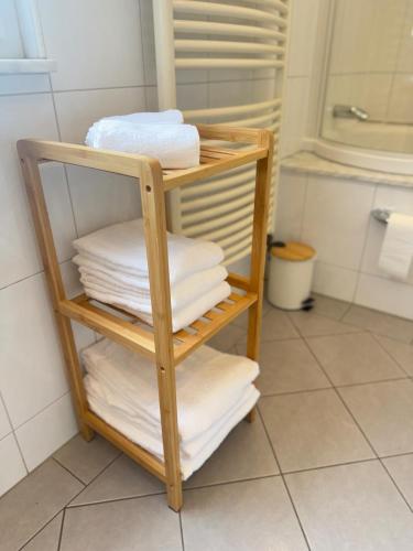 a towel rack with towels on it in a bathroom at Mahesars Home 2 in Ennepetal