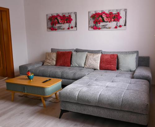 a living room with a couch and a coffee table at Mahesars Home 2 in Ennepetal