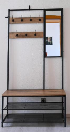 a dressing room with a mirror and a bench at Mahesars Home 2 in Ennepetal