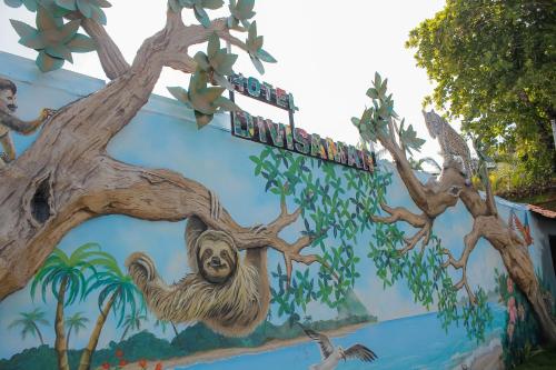 a mural of a monkey on the side of a building at Hotel Divisamar by LHR in Manuel Antonio