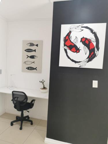 a desk with a chair and a picture of a lobster at Anyomi Zen in Gqeberha