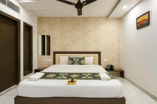 a bedroom with a large bed in a room at Hotel Tamanna - 50 Meter from Golden Temple in Amritsar