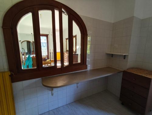 a bathroom with a sink and a window at La Serenita' in Marco Simone