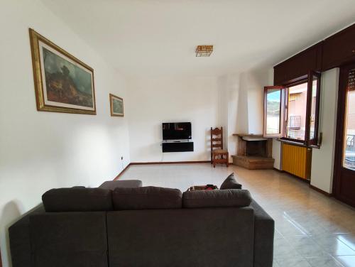 a living room with a couch and a table at La Serenita' in Marco Simone