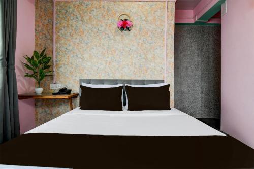 Ένα ή περισσότερα κρεβάτια σε δωμάτιο στο HOTEL O SPICY BISTRO