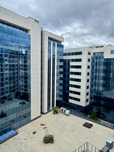 a view of two tall buildings in a city at ApartmanGrandTrade by Termax in Banja Luka