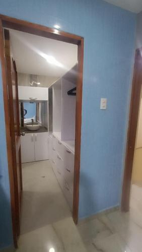 a room with a closet with white cabinets at Gabriela House in Ríohacha