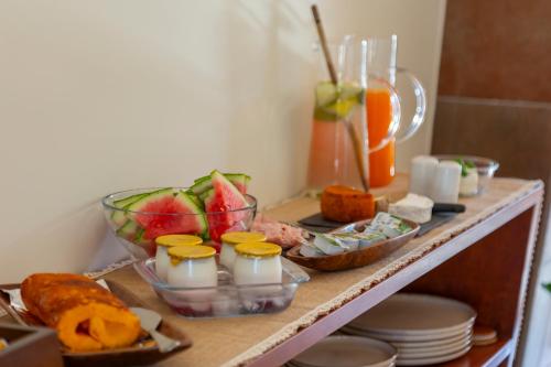 a table topped with different types of food at Casa da Câmara in Tondela