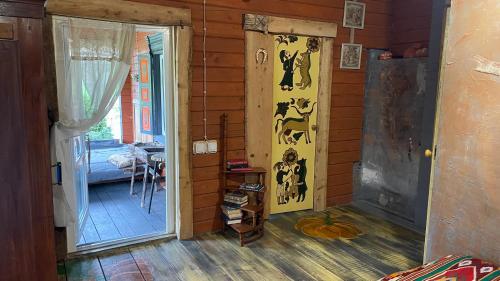 an entrance to a room with a door with animals on it at Chalet de Bella in Terlo