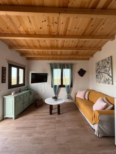 a living room with a couch and a table at Casa Saboa in San Bartolomé