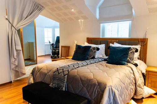 a bedroom with two beds with blue pillows at Private House by the River in Rovaniemi