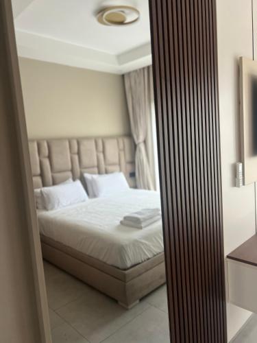 a bedroom with a bed with white sheets and white pillows at Cabo Luxury stay in Cabo Negro