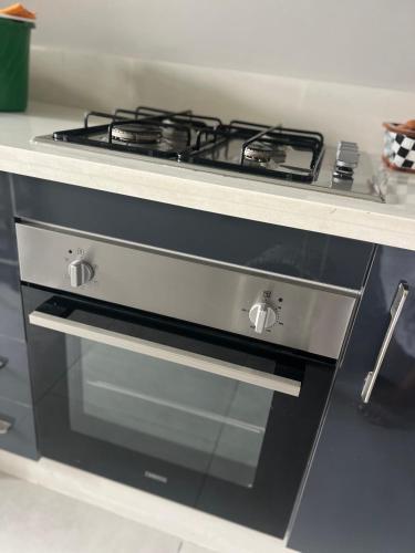 a stove top oven sitting in a kitchen at Cabo Luxury stay in Cabo Negro