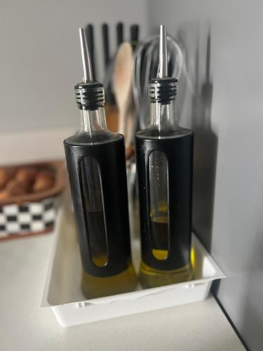 two bottles of oil sitting on a tray at Cabo Luxury stay in Cabo Negro