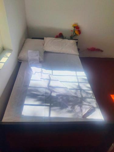 a large bed in a small room with at Maithree International Meditation Center in Matara