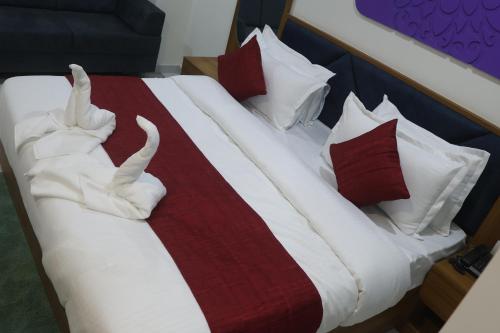 Un ou plusieurs lits dans un hébergement de l'établissement Hotel Metro City