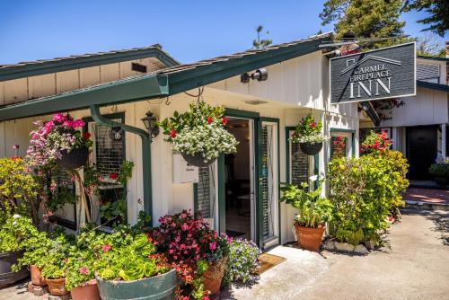 an entrance to a flower shop with potted plants at Carmel Fireplace Inn in Carmel
