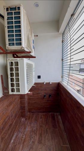 a room with two air conditioners on the wall at 2 bedrooms with attached baths in Karachi