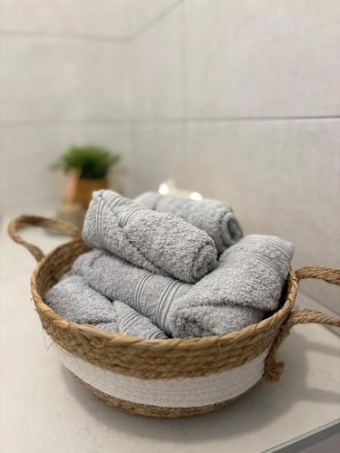 a basket of towels sitting on a counter in a bathroom at La chiave della felicita Casoli in Casoli