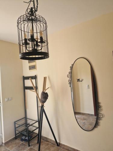 a mirror and a chandelier in a room at Lovely Home by the Beach in Kruče