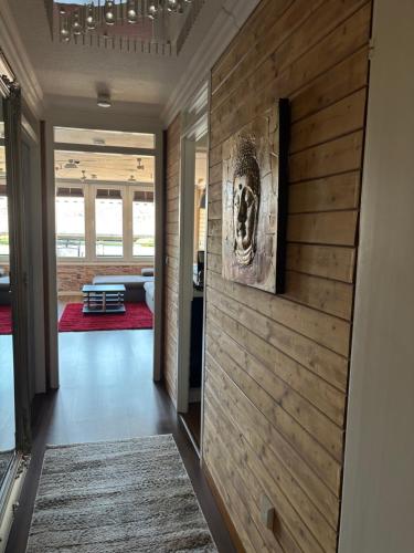 a hallway with a wooden wall in a house at Apartment im Sasbachwalden Schwarzwald in Sasbachwalden