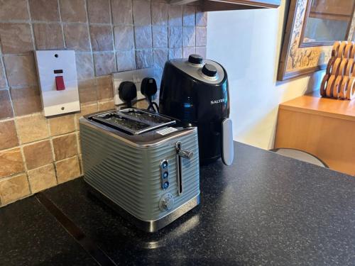 a toaster sitting on top of a kitchen counter at Spacious Two Bed near Airport in Celbridge