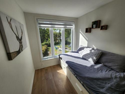 Ένα ή περισσότερα κρεβάτια σε δωμάτιο στο Chalet familial, vue sur le lac