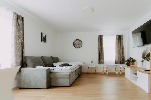 a living room with a couch and a table at Kupferdachl in Sankt Lambrecht