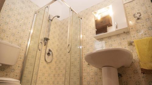 a bathroom with a shower and a sink at Case Bongiovi in Sciacca