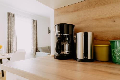 a coffee maker sitting on top of a counter at Kupferdachl in Sankt Lambrecht