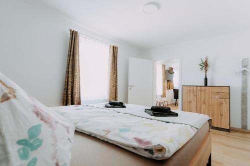 a bedroom with a bed with two hats on it at Kupferdachl in Sankt Lambrecht