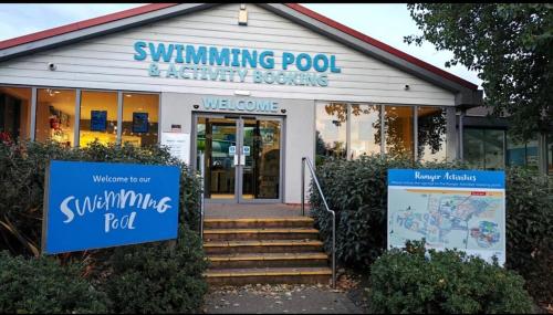 a swimming pool activity centre with a sign in front of it at 9 Fairway, Hopton Holiday Park - Three bedroom, sleeps 6, kitchen, lounge and dining area - Minimum 3 night breaks in Hopton on Sea