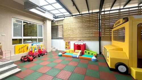 a room with toys on a tiled floor at Wawa Ocean Family B&B in Taitung City