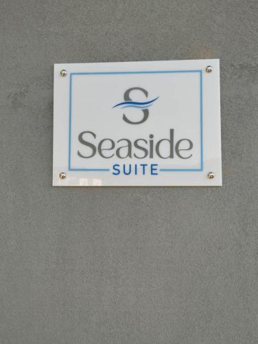 a sign for aseaide suite on a wall at Seaside Suite in Galissas