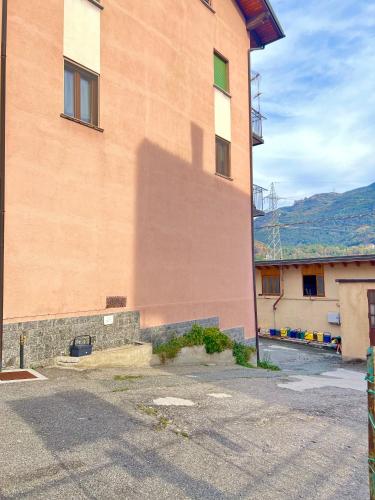 a building with a shadow on the side of it at Dolce Settembre in Châtillon