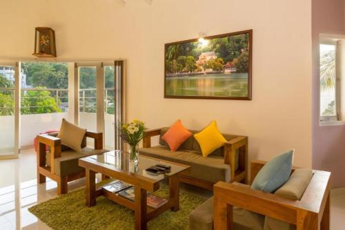 a living room with a couch and a table at Shalom Residence Kandy in Kandy