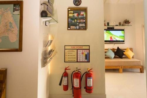 a room with two fire hydrants hanging on the wall at Shalom Residence Kandy in Kandy