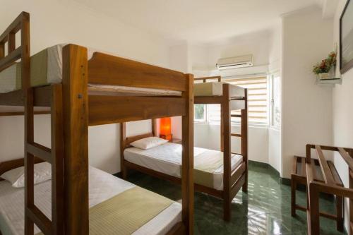 a room with three bunk beds in a room at Shalom Residence Kandy in Kandy