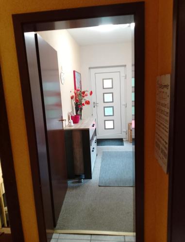 a view of a bathroom through a glass door at Jules Heim mit Herz in Hanshagen