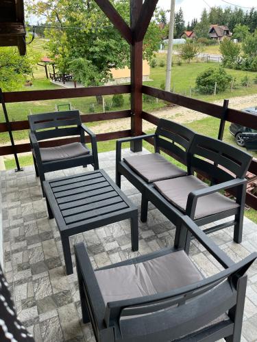 a group of benches sitting on a patio at Tara Nest in Kaludjerske Bare
