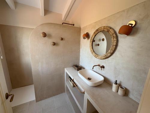 a bathroom with a sink and a mirror at Villa Estrellita Sant Lluis in Sant Lluis